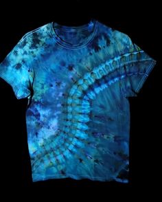 Medium ice dyed geometric design in blues and greens.       This shirt will make a perfect addition to your tie dye collection!     All my shirts are pre washed and soaked in soda ash then treated post dye so colors won't bleed or fade.     I use professional high quality fiber reactive procion dye by Dharma. Please message me with any questions. Thanks for looking ✌️ Hand Dyed Blue Bohemian Tops, Blue Hand Dyed Bohemian Tops, Bohemian Hand-dyed Blue Tops, Blue Bohemian Hand Dyed Top, Skater Wear, Procion Dye, Soda Ash, Mount Shasta, Ice Dye