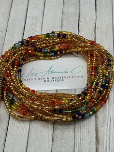 "Welcome to Luxe Adornments, where our handmade designs by Vee Webb meet spirituality, self-love, and balance. Our Matte Chakra Waist Beads are the perfect addition to any outfit or personal ritual. 💫💖 Each chakra is associated with a color and energy center in the body. The 7 chakras include: Root chakra - Red Sacral chakra - Orange Solar plexus chakra - Yellow Heart chakra - Green Throat chakra - Blue Third Eye chakra - Indigo Crown chakra - Violet Our waist beads are made with high-quality Beaded Bohemian Waist Beads As Gift, Bohemian Beaded Waist Beads As A Gift, Bohemian Adjustable Waist Chain With 108 Beads, Handmade Bohemian Waist Chain With Round Beads, Bohemian Waist Chain With Tiny Beads, Bohemian Waist Chain With Round Beads, Bohemian Beaded Waist Chain As A Gift, Bohemian Style Colorful Waist Beads For Gift, Spiritual Multicolor Beaded Bracelets With Gold Beads