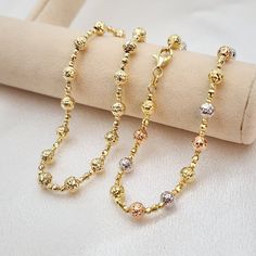 Stunning real 14k white, yellow and rose or plain 14k yellow gold diamond cut bead bracelet. Perfect for everyday and every occasion. Unique, shiny and elegant. This bracelet will make the perfect gift. 14k gold will not tarnish or rust.  Real 14k gold. Not plated, not vermeil. Materials: 14k white, yellow and rose gold Lenght: 7.5 Inches Thickness: - Big bead 5mm  - small bead 2mm Weight: 3.6 grams 14k stamped Brand new For her  Briza Collections is a small family owned business that works hard Chain Diamond, Gold Plated Bracelet, Gold Bracelets, Solid Gold Jewelry, Bead Chain, Gold Plated Bracelets, Copper Color, Bracelet Gold, Gold Beads