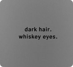 the words dark hair whiskey eyes are written in black on a gray background