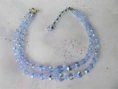 What a beautiful high quality crystal bead necklace! Two gorgeous strands of faceted sparkling beads, in a dreamy blue color with aurora borealis finish. The necklace is about 15 inches , a beautiful necklace. Condition is excellent vintage. All original and intact, the crystals are sparkling. Strands appear secure, silver tone clasp finish is intact. What a fabulous necklace to enjoy wearing or gift a bride to be. Enjoy wearing it and adding it to your collection of vintage costume jewelry. We Blue Crystal Necklaces For Wedding, Blue Crystal Necklace For Wedding, 1950s Jewelry Style, 1950s Jewelry, Antique Costume Jewelry, Blue Crystal Necklace, Crystal Goddess, Beading Jewelery, Crystal Bead Necklace