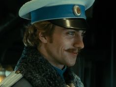 a man wearing a blue hat and scarf in the movie captain america, which is currently on dvd