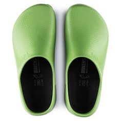 a pair of lime green shoes with black soles