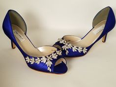 "Royal Blue Wedding Shoes. Perfect shoes for your special day. These wedding shoes have been dyed Rio Sapphire (commonly known as Royal Blue or Cobalt Blue) but are also available in over 100 colors as well as sending a swatch color for me to color match. These sparkling wedding shoes have an intricate sparkling rhinestone design going across the front of the shoes and down the side. The shoes in the listing have a 2 1/2 inch heel, but is also available in a 1 3/4 inch heel. If you are picking a Blue Wedding Sandals, Gold Heels Wedding, Wedding Shoes Blue, Royal Blue Wedding Shoes, Sparkly Wedding Shoes, Blue Bridal Shoes, Sparkling Wedding, Royal Blue Shoes, Blue Wedding Shoes