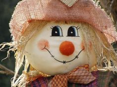 a close up of a scarecrow wearing a hat