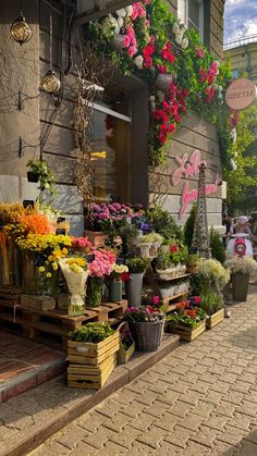 a flower shop on the side of a building