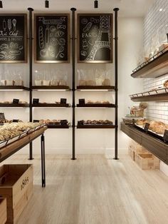 a bakery with lots of breads and pastries on shelves