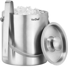 a stainless steel ice bucket with an ice scooper