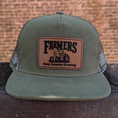 "Farmers keep America growing", mesh adjustable snapback hat Does your kid love tractors? In pairing original artwork with a leather patch and high quality craftsmanship, the hat is perfect for all your days on the farm! **SIZING INFO** Fits 18"-21" head circumference and have a mesh backing. The adjustable straps fit head circumference of 18-21 inches and fit best on ages three and up. Measure your child's head circumference to be sure! Every child is different. WHAT MAKES US DIFFERENT - We are Tractor Hat, Homestead Farm, Farm Gifts, Hat Ideas, All Kids, Just Run, Head Circumference, Leather Patches, Small Batches