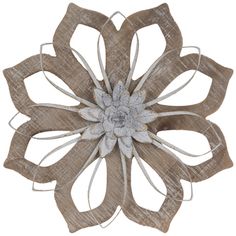 a large flower made out of fabric on a white background with clippings to the center