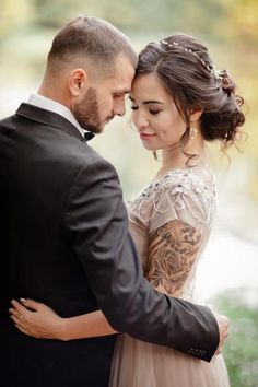 a bride and groom embracing each other