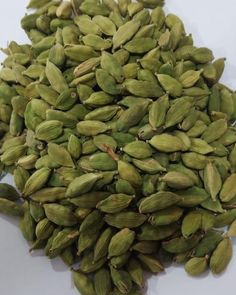 green cardamoa seeds on white background