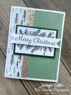 a christmas card with pine branches on it