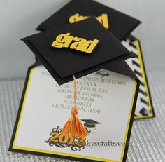 graduation caps and tassels on top of each other