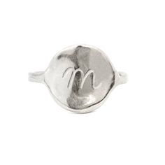 The Georgia Ring is a timeless signet ring, thoughtfully designed for effortless everyday wear. Its simple yet sophisticated silhouette embodies a sense of femininity and grace, with soft curves and a fluid, organic shape that moves naturally with the wearer. The design draws inspiration from the iconic artist Georgia O'Keeffe, renowned for her ability to capture the beauty of the natural world in its most abstract and evocative forms. Like O'Keeffe's work, the Georgia Necklace reflects a blend Adjustable Oval Dome Ring Minimalist Style, Minimalist Initial Ring In Polished White Gold, Minimalist Sterling Silver Dome Ring, Adjustable Minimalist Dome Ring, Elegant Sterling Silver Initial Ring, Timeless Everyday Initial Ring, Minimalist Engraved Ring With Initials, Elegant Everyday Initial Ring With Polished Finish, Minimalist Hand Forged Signet Ring For Anniversary