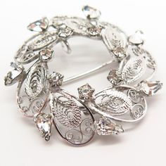 925 Sterling Silver Vintage Carl Art Rhinestone Filigree Leaf Design Pin Brooch Weight: 5.8g WELCOME TO PAWN SHOP We are an actual pawn shop and have been in business for over 25 years. Since 1990, our establishment has been serving a variety of clients by providing them with short term cash solutions and options of liquidity regarding their treasured heirlooms. Acknowledging that today′s customers are very sophisticated and are looking for a variety of investments, our acquisitions are hand-pic Silver Brooch Jewelry For Anniversary, Elegant Antique Silver Brooch Jewelry, Silver Costume Jewelry Brooch For Formal Occasions, Silver Costume Jewelry Brooches For Formal Occasions, Vintage Sterling Silver Brooches For Wedding, Silver Sterling Wedding Brooches, Silver Costume Jewelry Brooch, Vintage Sterling Silver Brooch For Wedding, Formal Silver Brooches With Rhinestones