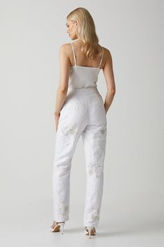 Introducing our Premium Embellished Jacquard Trousers, a stunning addition to your wardrobe. These white pants are meticulously embellished with intricate gold and silver details, adding a touch of elegance and sophistication to any outfit. Crafted with the utmost care and attention to detail, these trousers are designed to make a statement and elevate your style. Perfect for special occasions, these trousers are a must-have for those who appreciate exquisite craftsmanship and timeless beauty. Bridal Separates, Tapered Trousers, Pierced Jewelry, White Pants, Fashion Face, Gold And Silver, Timeless Beauty, Fashion Beauty, Special Occasion