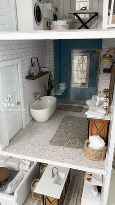 the inside of a doll house with all white furniture and accessories, including a bathtub