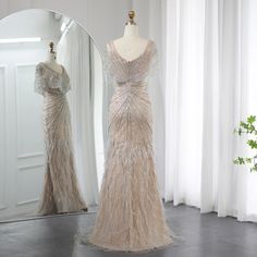 a dress on display in front of a mirror