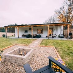 an outdoor fire pit in the middle of a yard