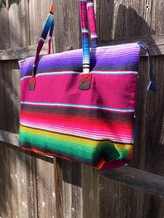 These colorful serape handbags make a great hand bag for everyday use! Makes a great gift! Measures approximately 19” wide Colors may vary Large Multicolor Beach Bag For Travel, Cute Diaper Bags, Mexican Folklore, Cowgirl Accessories, Market Bags, Utility Tote, Sunflower Earrings, Kids Apron, Diaper Bag Backpack