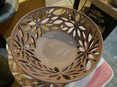 a brown bowl sitting on top of a table