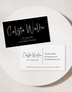 a white plate with a black business card on it