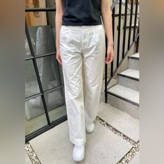 High Rise Relaxed Leg Pants With Two Pockets On The Front And Two Pocket With Button Closure At The Back, And Zipper Closure. Fabrics: 100% Cotton. Measurements: 11" (28cm) Rise, 31" (78cm) Inseam, 29" (74cm) Waist Made In: China Fitted Cotton Wide Leg Pants For Daywear, Casual Pants With Button Closure For Daywear, Cotton Bottoms With Button Closure For Daywear, Cotton High-waisted Pants, Classic White Wide-leg Pants, White Straight Leg Chinos For Work, Fitted White Cargo Pants For Work, White Wide-leg Cargo Pants For Work, White Straight-leg Chinos For Work