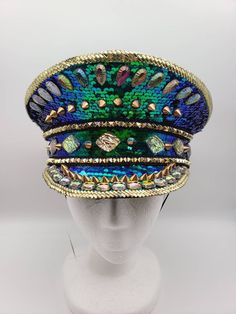 Blue and green iridescent music festival hat with multicolored stones and gold spikes. Changes color in different directions. One size. Gift From The Sea, Very Small Wedding, Pilot Costume, Police Hat, Goat Horns, Military Hats, Lace Braid, Festival Hat, Halloween Masquerade