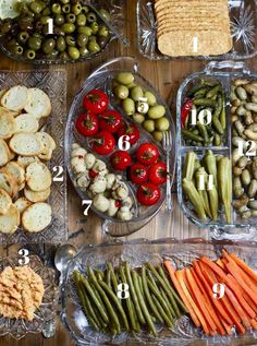 a table topped with lots of different types of vegetables and crackers next to each other