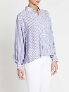 Cruise through the weekend in the emmy blouse in summer stripe by current elliott. crafter from super soft rayon this over sized blouse features a lightweight stripe a classic collar and is finished with cuffed sleeves. this beautful blouse is made to swing a little. throw it on over skinny denim for that dream combo of loose and fitted structured and flow.    ---- fabric or composition    the emmy blouse in summer stripes is made from 100% rayon    size and fit    the emmy blouse in summer stri Spring Oversized Blouse With Striped Collar, Oversized Blouse With Striped Collar For Spring, Striped Collared Blouse With Placket, Classic Top With Striped Collar For Daywear, Classic Striped Blouse With Relaxed Fit, Classic Summer Blouse With Striped Collar, Spring Daywear Shirt With Striped Cuffs, Striped Blouse With Placket For Work, Classic Striped Tops For Daywear