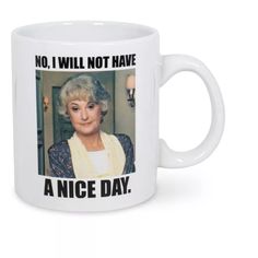 a white coffee mug with an old woman's face and words on the side