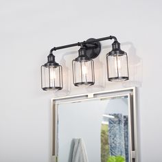 three light bathroom fixture with clear glass shades