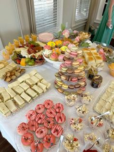 an assortment of pastries and desserts on a table