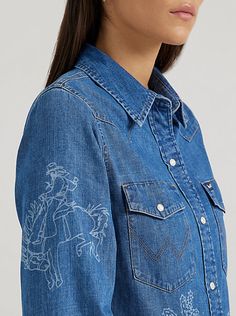 Doubling up on denim is all too easy with our Women’s Wrangler Retro® Lasered Icons Cowboy Snap Shirt. It’s covered in Western-inspired motifs that have been lasered in for a contrast look that’s effortlessly cool. This collared long-sleeve shirt also comes with pointed yokes, two chest pockets with flaps, the signature ‘W’ stitching, and pearl snaps. Plus, it features a slim fit that’s flattering on its own or easy to style layered over your outfit. Fit: Slim Sleeve Length: Long Front Closure: Womens Denim, Retro Women, Western Shirts, Denim Women, Western Fashion, Snap Closure, Sleeve Shirt, Everyday Wear, Cowboy