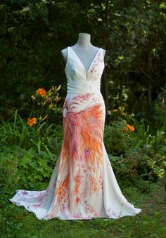 a dress is displayed on a mannequin in the grass