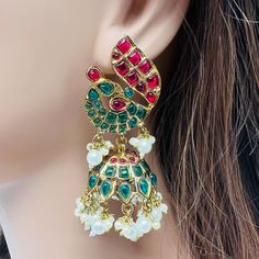 High quality peacock design indian jhumka earrings detailed with green,ruby color stone and pearls it looks more classy. Lightweight and elegant. Earrings length: 3 inches  Earrings width: 1.4 inches  You can also prafer it as a gift for someone special on their birthday,anniversary or any special occasion to make their day and let them remember you whenever they wear it. Occasion to wear: Party, wedding, marriage, kitty parties and any special occasion. Care instructions: Avoid Heat and Chemica Luxury Multicolor Fusion Jhumkas, Indian Jhumka, Ruby Color, Kitty Party, Peacock Design, Cat Party, Jhumka Earrings, Earrings Green, Ruby Stone