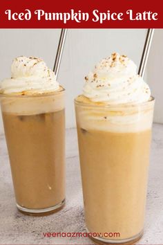 two iced pumpkin spice lattes with whipped cream