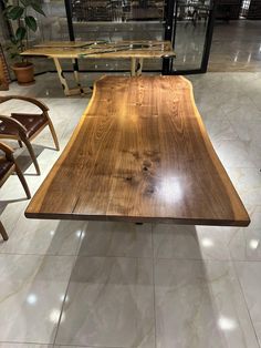 a wooden table sitting on top of a white tiled floor