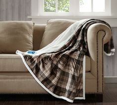 a couch with a blanket on top of it