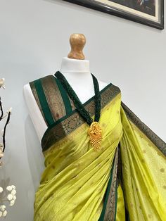 Discover the timeless beauty of our high-quality Banarasi saree, perfect for any occasion(wedding or parties). An apt pick for wedding or any kind of occasion. Very high quality, soft and pleats well. This set is completed with an unstitched blouse fabric. Green Tussar Silk Pre-draped Saree, Green Dola Silk Pre-draped Saree For Diwali, Green Paithani Silk Pre-draped Saree With Self Design, Festive Green Pre-draped Saree With Pallu, Festive Green Paithani Silk Pre-draped Saree, Festive Green Pre-draped Saree With Zari Weaving, Green Pre-draped Saree With Zari Weaving For Diwali, Green Art Silk Handloom Blouse Piece, Green Tussar Silk Pre-draped Saree With Cutdana