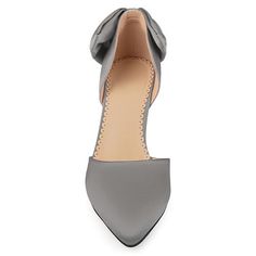 Journee Collection Women's Tanzi Pump Add evening wear to your style with pumps by Journee Collection. These pumps highlight smooth fabric and a sleek pointed toe style. A large bow accent adorns the closed back heels and adds feminine detail to the design.  Heel Height: 3-inch Heel Type: Heel  Platform Height: 1/2-inch Shoe Width: Medium Closure Type: Slip-on Toe Style: Pointed Lining: Faux Leather Upper Material: Fabric Outersole Material: Fabric over Synthetic Footbed:  Padded  Good to Know All measurements are approximate and were taken using a size 6. Please note measurements may vary slightly by size.