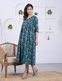 This printed ethnic wear dress is presented to you, A well-known brand in hand block prints from over 9 decades. This exclusively hand stitched dress is made of 100% pure cotton fabric with having printed prints over it. The dress is best suitable for you to showcase your women hood. Wear this at your ease and the fabric is so smooth to skin that you will love it and the attractive prints adds more charm to the same. Material : 100% Cotton dress Length : 54 Inches Disclaimer : As the fabric is block printed , It may have slight irregularities in colors and prints. These irregularities are the stamp of authenticity of all hand block printed products. Actual product may vary due to lighting conditions. Wash Care & Instructions : Gentle Hand Wash Separately In Cold Water With Mild Liquid Dete Indigo Cotton Kurta With Bandhani Print, Festive Cotton Ikat Print Dress, Traditional Blue Cotton Dress, Traditional Cotton Dress With Kalamkari Print, Cotton Anarkali Dress With Block Print, Traditional Bandhani Print Mulmul Dresses, Traditional Cotton Dress With Floral Print, Traditional Mulmul Dress With Bandhani Print, Indigo Cotton Dresses With Floral Print