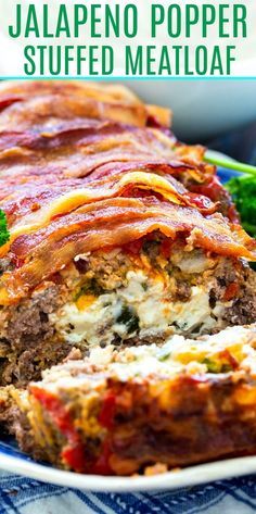 a meatloaf with cheese and sauce is cut in half on a plate next to broccoli