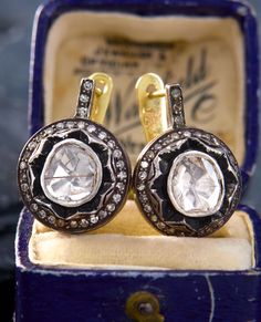 pair of diamond and gold earrings in box