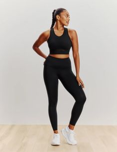 When you want it all, this smooth racerback style is what you need. This sports bra doubles as a workout top so you can effortlessly transition from the gym to the rest of your day. Sewn-in padding and stretchy fabric gives you medium support, seamless feel and none of the shifting. It’s all-around comfort plus a peek of cool mesh. And the secret to the extra pep in your step. | Knix Momenta Racerback Sports Bra in Black Versatile 4-way Stretch Racerback Sports Bra, Sporty Racerback Activewear With Built-in Padding, Athletic Fit Activewear With Built-in Bra For Training, Stretch Racerback Activewear For Workout, Stretch Racerback Athleisure Activewear, Racerback Stretch Activewear In Athleisure Style, Racerback Seamless Activewear For Yoga, Solid Racerback Go-dry Activewear, High Stretch Racerback Activewear For Gym