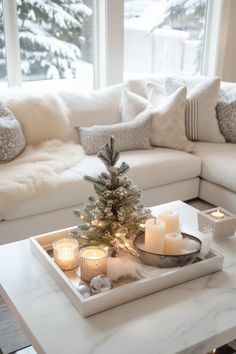 a tray with candles and a christmas tree on it