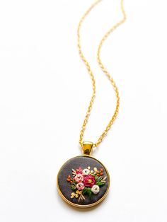 ARIA'S HAND EMBROIDERED WILDFLOWERS NECKLACE Nothing brightens a day like flowers do. So here's some flowers you can wear everyday to bring some cheer to your day and outfit. It never wilts plus it's a conversation piece too! I hand embroider every intricate piece, and each pattern is hand drawn so no two necklaces will be exactly the same. This necklace is proudly handmade in the Philippines. - - - - - - - - - - - - - - - - - - - - - - - - - - - - - - - - - - - - - - - - - - - DETAILS: * Pendan Bohemian Embroidered Jewelry For Wedding, Bohemian Flower Pendant Necklace For Wedding, Floral Embroidered Flower Jewelry For Weddings, Bohemian Wedding Necklaces With Flower Charm, Embroidered Wildflowers, Boho Embroidery, Tiny Pendant, Jewelry Birthday, Wedding Anniversary Gift