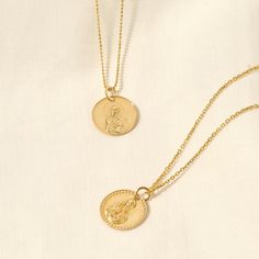 This stunning Mary & Jesus Necklace is a beautiful symbol of faith and devotion. It is a timeless keepsake that will be cherished for years to come. Its simple yet eye-catching design makes it the ideal accessory for any occasion. Let this Mary & Jesus Necklace grace your neck as a reminder of your spiritual journey. - Made in 14k solid gold - Pendant Diameter: 15.80 mm / 0.62 inches - Pendant Thickness: 0.76 mm / 0.03 inches - This product comes with iconic Norm Jewels gift box Jesus Necklace, Catholic Necklace, Beautiful Symbols, Gold Designs, Mary And Jesus, Linking Rings, Rose Gold Pendant, Shades Of Gold, Gifts For My Wife