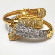 "These goregous bracelet has brilliant simulated pave set stones that sparkle brightly in any light. It's perfect for the any time you want to feel special. Made of High Quality CZs. The plating has a gold content of approx 5 to 15 milligrams complete with rhodium plating that makes this bracelet set to last!  fits up to 7.25\" wrist." Dazzling Bracelets With Pave Setting In Cubic Zirconia, Dazzling Bangle Bracelet With Pave Setting, Dazzling Bangle Bracelet With Pavé Setting, Dazzling Pave Bangle Bracelet, Dazzling Pave Setting Bangle Bracelet, Party Bracelet With Pave Setting, Diamond White Cubic Zirconia Bangle With Pave Setting, Gold Bracelets With Pave Setting For Wedding, Gold Wedding Bracelets With Pave Setting